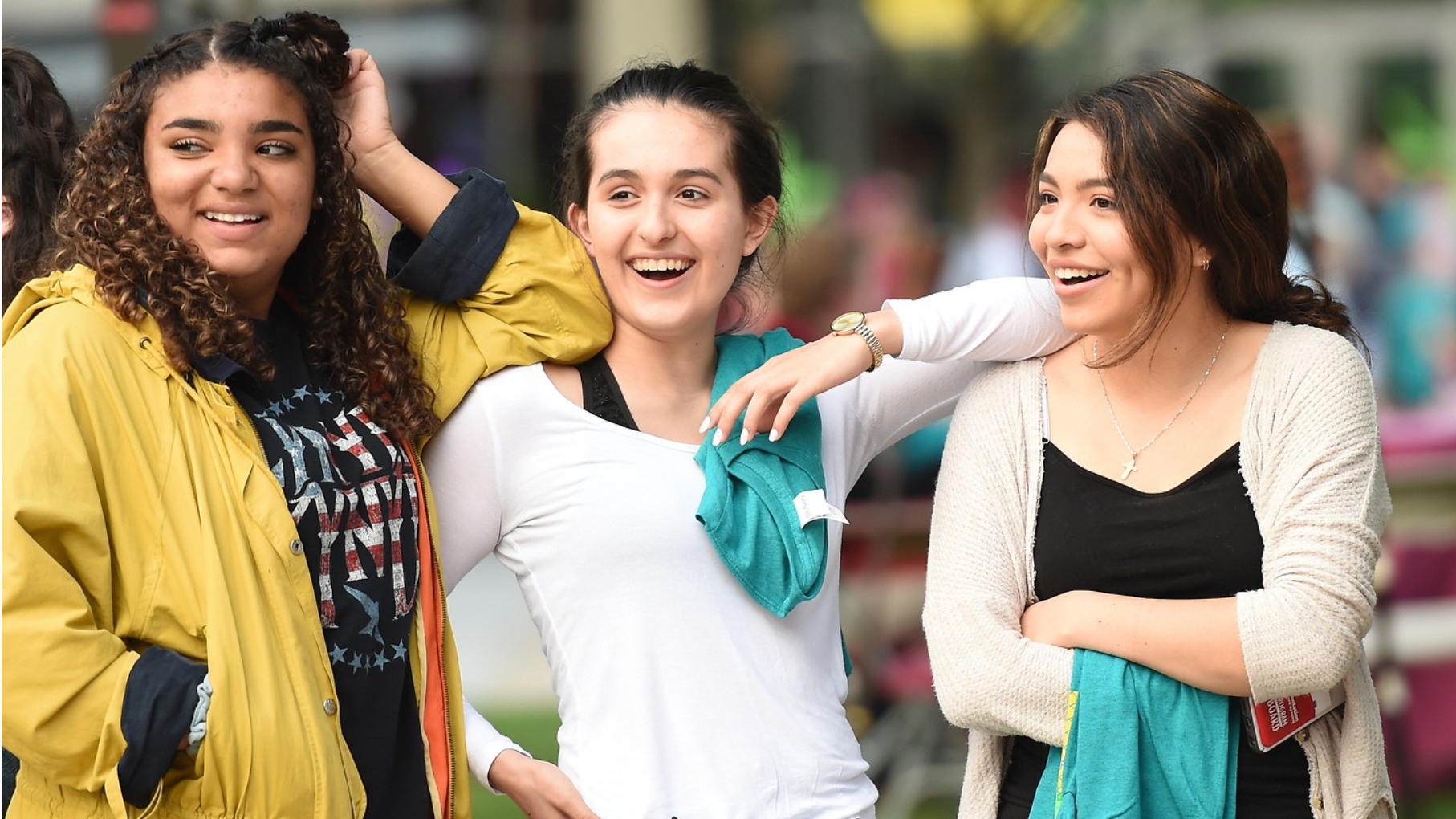 Three female undergraduate students smiling